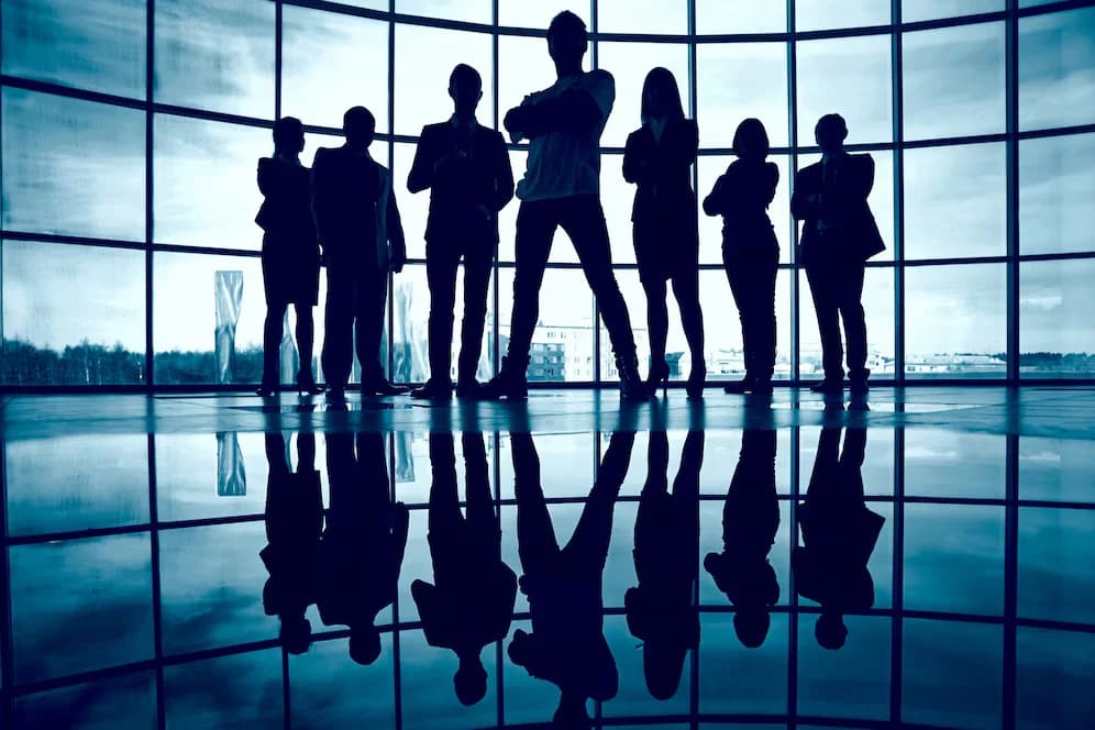 Confident businesspeople in futuristic office